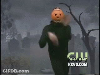 Man With Pumpkin On Head Dancing In Front Of KXVO Logo GIF