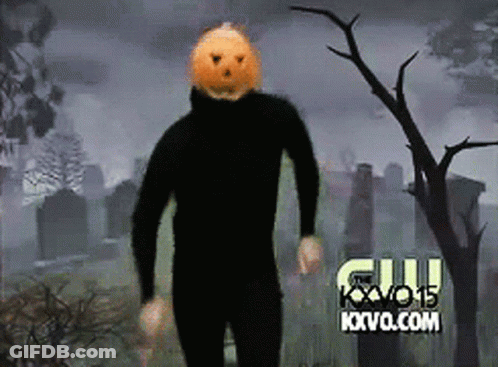 Man With Pumpkin On Head In Cemetery Sponsored By Kvvo.com GIF