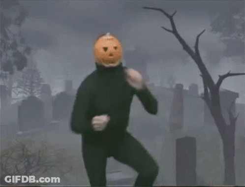 Man With Pumpkin On Head In Cemetery GIF