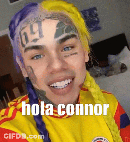 Man With Purple And Yellow Hair Saying Hola Connor GIF
