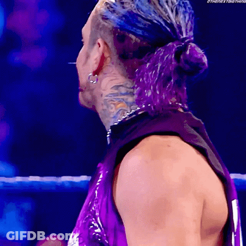 Man With Purple Hair And Tank Top And Earrings GIF