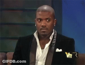 Man With Purple Hair And Yellow Hoodie Sitting GIF