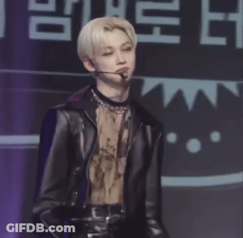 Man With Purple Hair Holding Microphone Smiling GIF