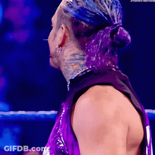 Man With Purple Hair Standing In Ring GIF
