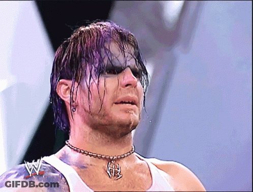 Man With Purple Hair Wearing White Tank Top And H Necklace GIF