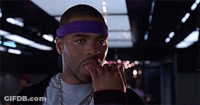 Man With Purple Headband Licking Fingers GIF