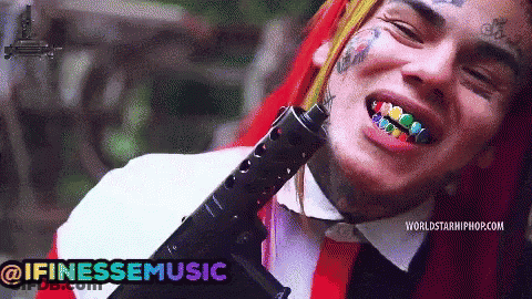 Man With Rainbow Teeth Holding Gun @Ifinessemusic GIF
