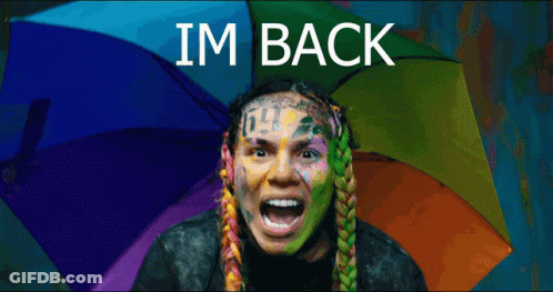 Man With Rainbow Umbrella Saying I'm Back GIF