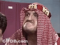 Man With Red And White Scarf Making Funny Face GIF