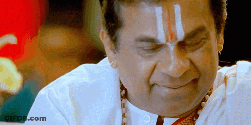 Man With Red And White Stripe On Forehead Looking Down GIF
