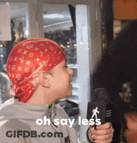 Man With Red Bandana Holding Microphone GIF