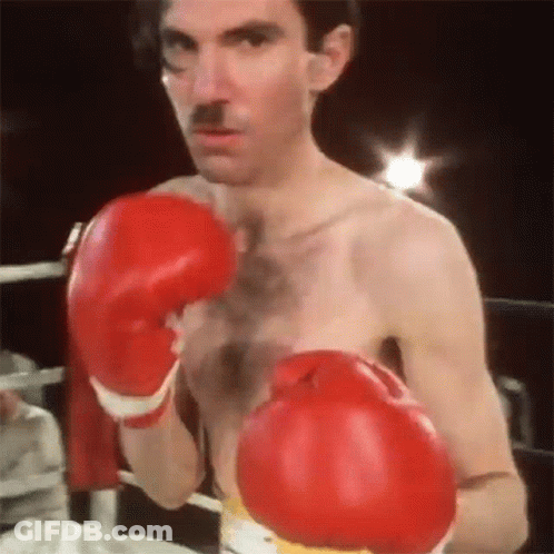 Man With Red Boxing Gloves And Mustache GIF