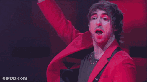 Man With Red Clown Nose And Pink Jacket GIF