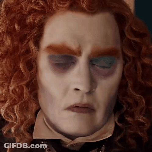 Man With Red Curly Hair And Blue Eyeshadow GIF