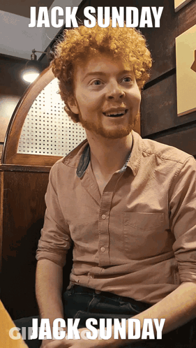 Man With Red Curly Hair Sitting In Booth Jack Sunday GIF