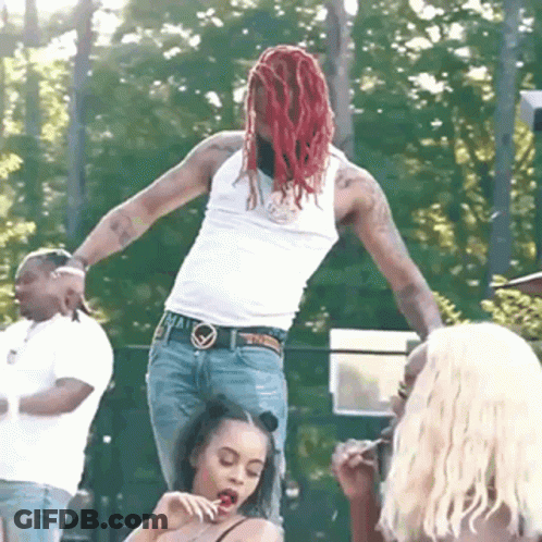 Man With Red Dreadlocks Standing On Woman's Lap GIF