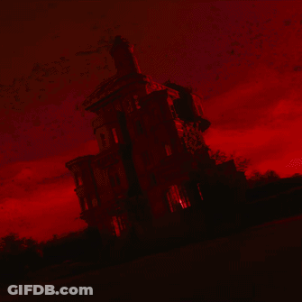 Man With Red Eyes Lying Upside Down In Dark Room GIF