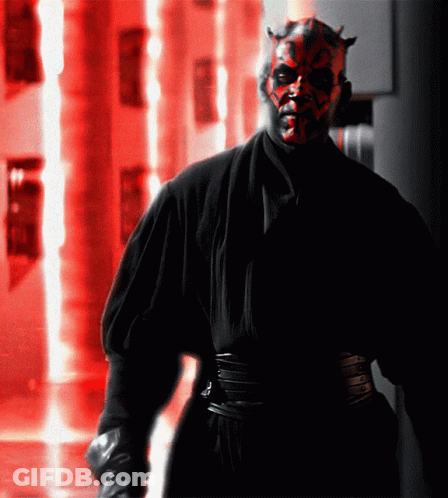 Man With Red Face And Horns In Black Robe GIF