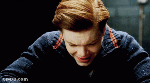 Man With Red Hair And Blue Sweater Smiles GIF