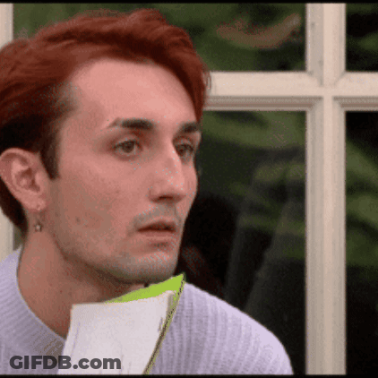Man With Red Hair Holding Paper GIF