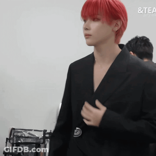 Man With Red Hair In Front Of Tea Sign GIF