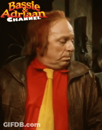 Man With Red Hair Red Shirt And Yellow Tie GIF