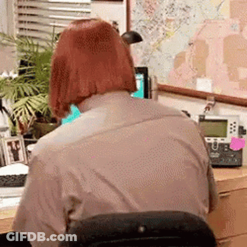 Man With Red Hair Sitting At Desk GIF