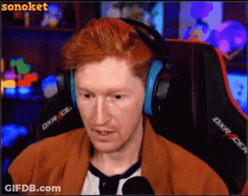 Man With Red Hair Wearing Headphones Sitting In Chair DXR GIF
