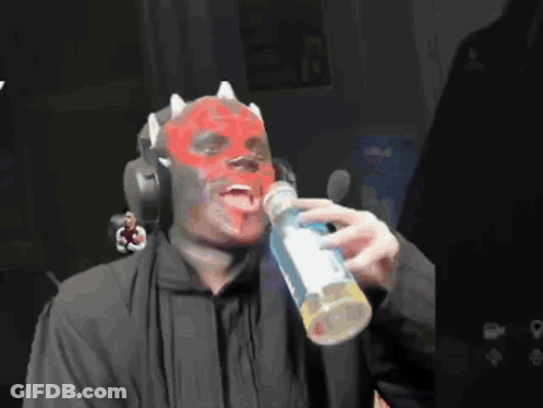 Man With Red Mask Drinking Bottle Of Soda GIF