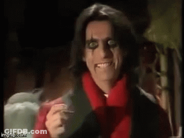 Man With Red Scarf Holding Knife GIF