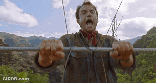 Man With Red Scarf Holding Wire Mouth Open GIF
