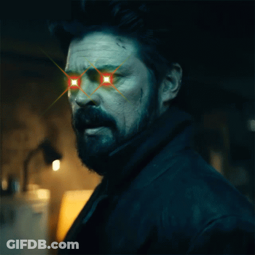 Man With Red Star In Eye And Noted Behind Him GIF