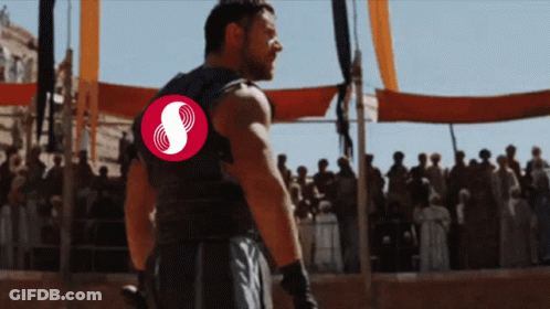 Man With Red Symbol On Back Before Crowd GIF