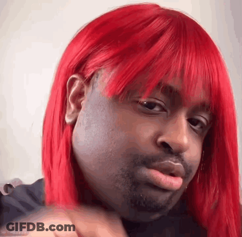 Man With Red Wig Making Funny Face GIF