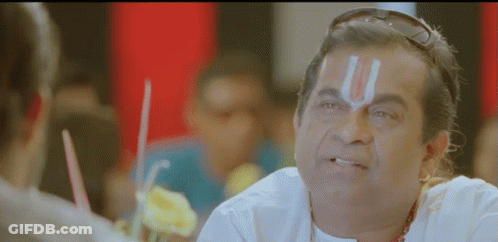 Man With Religious Symbol Forehead Talking To Another GIF