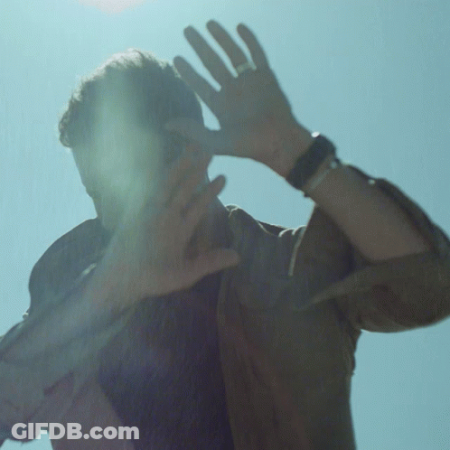 Man With Ring Covering Face GIF