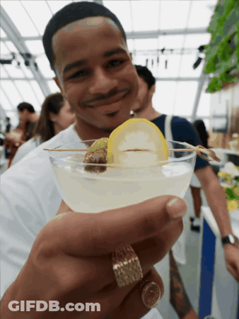 Man With Ring Holding Martini GIF