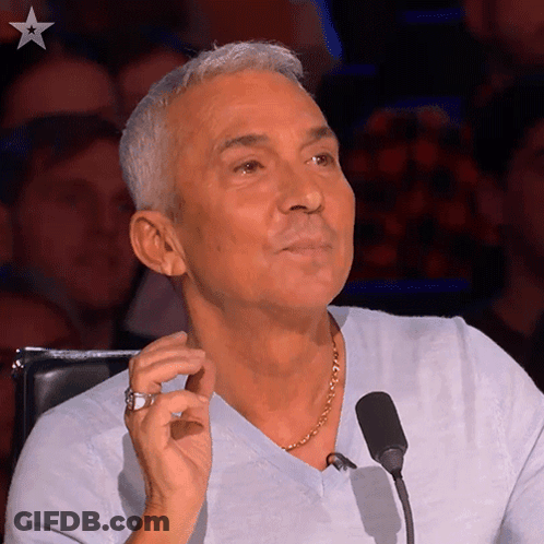 Man With Ring Sitting At Microphone GIF