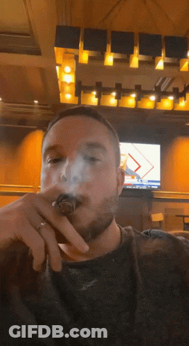 Man With Ring Smoking Cigar GIF