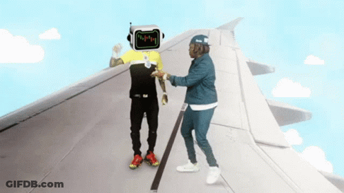 Man With Robot Head Talks To Another Man On Plane Wing GIF