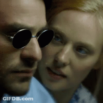 Man With Round Sunglasses Looking At Woman GIF