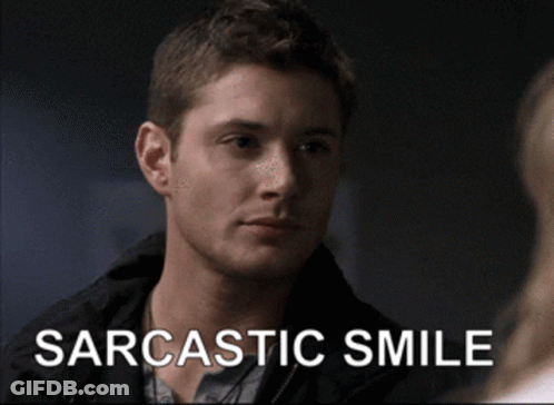 Man With Sarcastic Smile Looking At Another Man GIF
