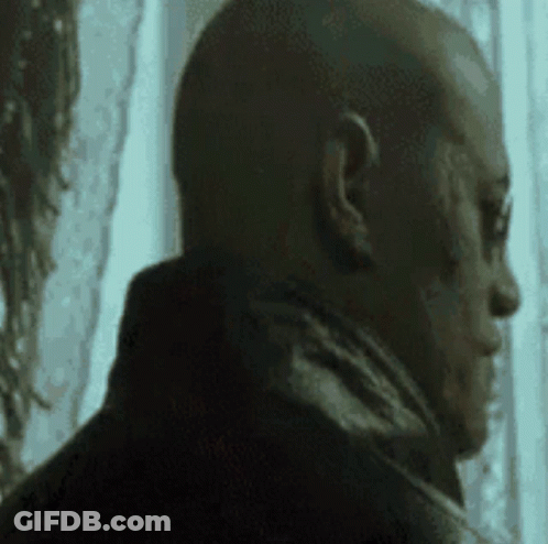 Man With Scar Looking Out Window GIF