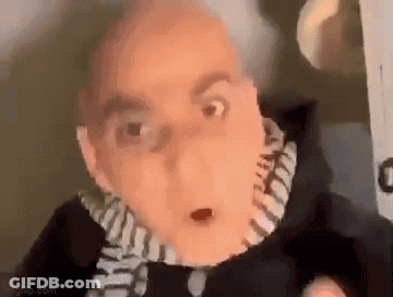 Man With Scarf And Surprised Look GIF