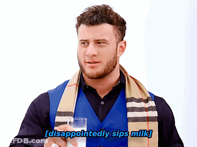 Man With Scarf Disappointed Sips Milk GIF