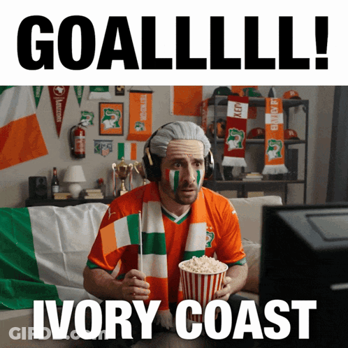 Man With Scarf Holding Popcorn Watching Ivory Coast GIF
