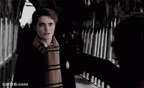 Man With Scarf Looking At Another Man GIF