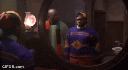 Man With Scarf Talking To Another Man GIF