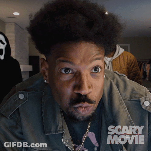 Man With Scary Movie Poster On Jacket GIF