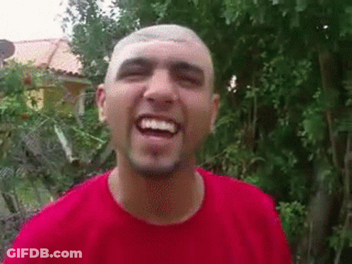 Man With Shaved Head And Beard Smiling In Red Shirt GIF